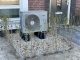 Luft-Wärmepumpe vor einem Einfamilienhaus: Deutsche offenbaren Schizophrenie beim Klimaschutz